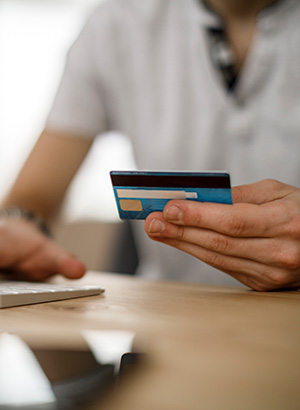 Hand holding a credit card