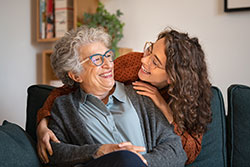 woman hugging family member