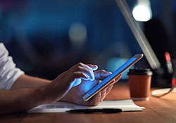 closeup of hands using a tablet computer