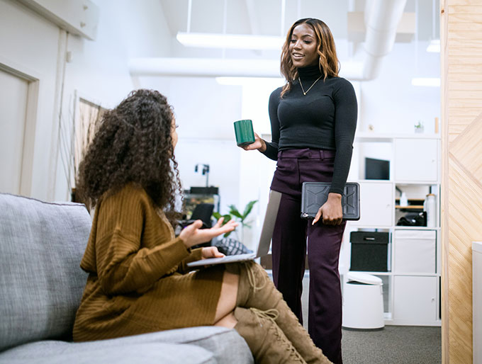 two business women talking