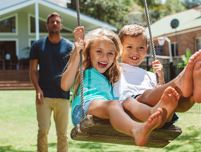 Kids on a tree swing