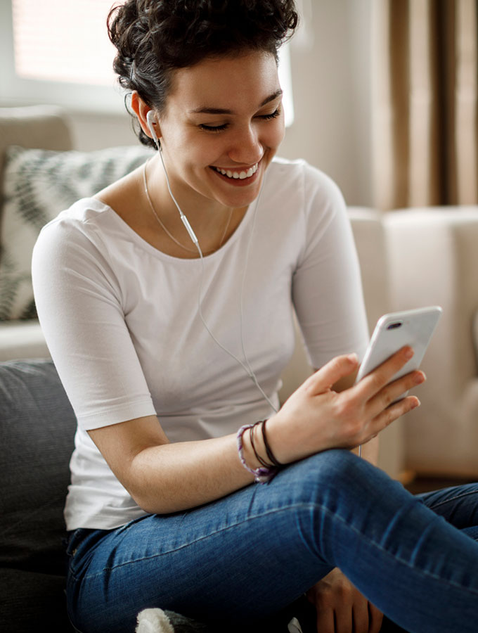 woman on phone at home smiling